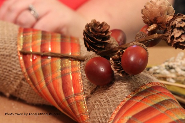 Rustic Fall Burlap Wreath DIY. This DIY tutorial on how to make a Rustic Fall Burlap Wreath has easy to follow, step-by-step instructions. Less than an hour or so of your time results in a lovely autumn wreath that is highly customizable, and a lot less expensive than a store bought wreath! Perfect fall decor for your front door. 