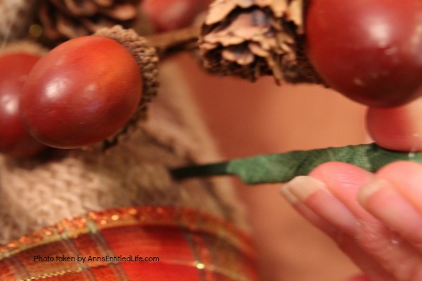 Rustic Fall Burlap Wreath DIY. This DIY tutorial on how to make a Rustic Fall Burlap Wreath has easy to follow, step-by-step instructions. Less than an hour or so of your time results in a lovely autumn wreath that is highly customizable, and a lot less expensive than a store bought wreath! Perfect fall decor for your front door. 