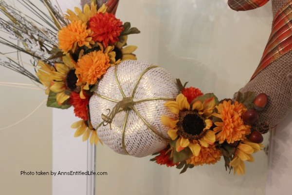 Rustic Fall Burlap Wreath DIY. This DIY tutorial on how to make a Rustic Fall Burlap Wreath has easy to follow, step-by-step instructions. Less than an hour or so of your time results in a lovely autumn wreath that is highly customizable, and a lot less expensive than a store bought wreath! Perfect fall decor for your front door. 