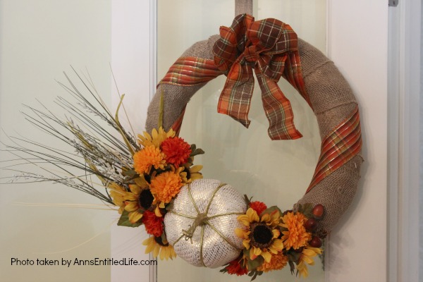 Rustic Fall Burlap Wreath DIY. This DIY tutorial on how to make a Rustic Fall Burlap Wreath has easy to follow, step-by-step instructions. Less than an hour or so of your time results in a lovely autumn wreath that is highly customizable, and a lot less expensive than a store bought wreath! Perfect fall decor for your front door. 