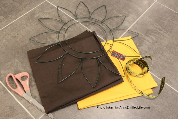 Sunflower Knot Wreath. This DIY tutorial on how to make a sunflower knot wreath has easy to follow, step-by-step instructions. An hour or so of your time results in this lovely sunflower knot wreath, perfect for your front door!