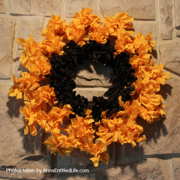 Sunflower Knot Wreath. This DIY tutorial on how to make a sunflower knot wreath has easy to follow, step-by-step instructions. An hour or so of your time results in this lovely sunflower knot wreath, perfect for your front door!