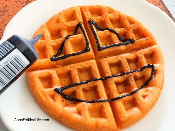 Jack-O'-Lantern Waffles Recipe. A fun fall breakfast, this Jack-O'-Lantern Waffles Recipe is easy to make and delicious! Your kids (and you) will start the day with a smile when you enjoy this sweet and charming morning repast.