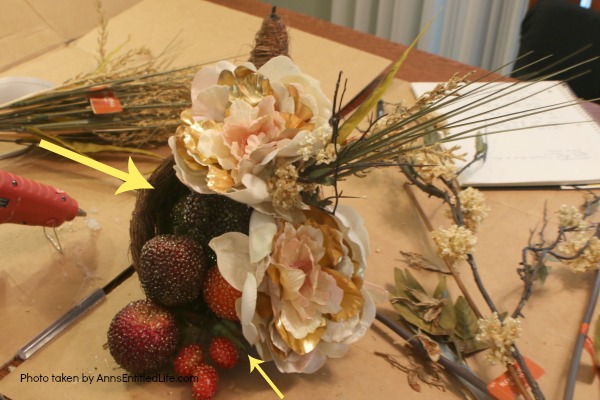 Floral Horn of Plenty DIY. This beautiful floral horn of plenty is a wonderful centerpiece or end table decorative piece, perfect for the fall season. A wonderful Thanksgiving decor accessory, this overflowing cornucopia is easy to make, and highly customizable.