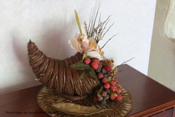 Floral Horn of Plenty DIY. This beautiful floral horn of plenty is a wonderful centerpiece or end table decorative piece, perfect for the fall season. A wonderful Thanksgiving decor accessory, this overflowing cornucopia is easy to make, and highly customizable.