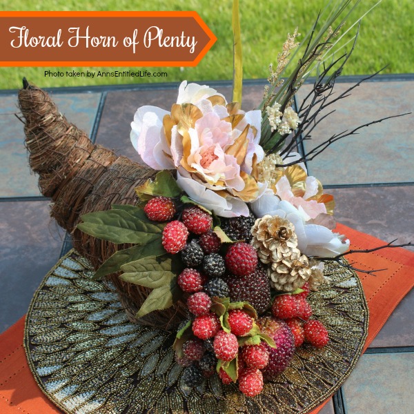 Floral Horn of Plenty DIY. This beautiful floral horn of plenty is a wonderful centerpiece or end table decorative piece, perfect for the fall season. A wonderful Thanksgiving decor accessory, this overflowing cornucopia is easy to make, and highly customizable.