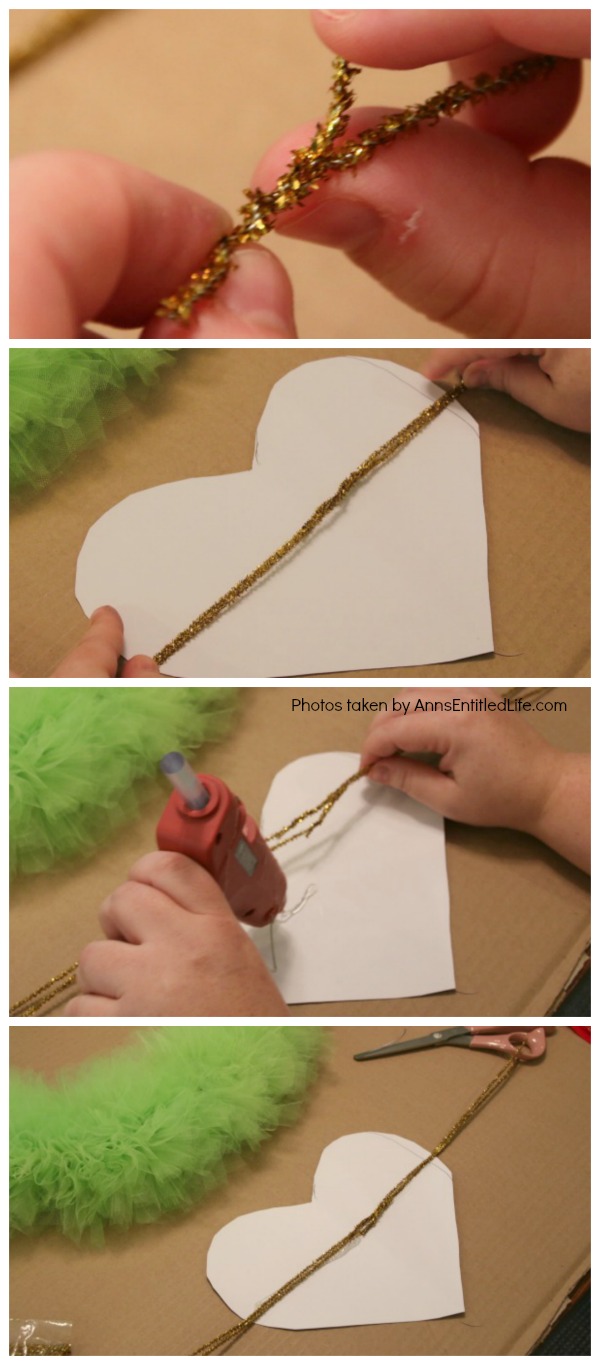 The Grinch Inspired Wreath DIY Tutorial. A beautiful Mr. Grinch inspired wreath sure to make even the coldest heart burst! This step by step tutorial is complete with (free) pdfs for the hat and heart for you to print and make exact. This wreath will look great on your front door, over your mantel, or on a wall. Truly unique holiday decor!