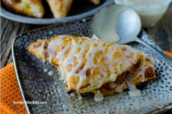 Easy Maple Pumpkin Turnovers Recipe. These amazing maple pumpkin turnovers are a wonderful breakfast treat you entire family will enjoy. Perfect for an on-the-go breakfast, packed in a lunchbox, or as a fabulous dessert, these pumpkin turnovers are a sweet and tasty delight.