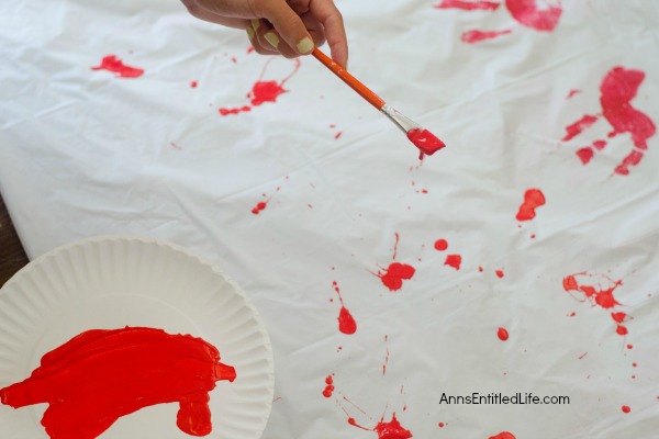 Zombie Blood Clot Tablecloth. Instead of paying big bucks for a Halloween tablecloth, make this simple Zombie tablecloth. It adds a touch of spooky to your Halloween party table. Five minutes, plus dry time, and your Halloween table has a spooktacular covering!