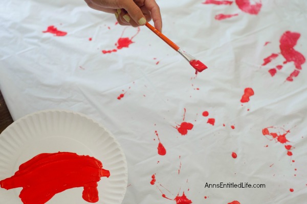 Zombie Blood Clot Tablecloth. Instead of paying big bucks for a Halloween tablecloth, make this simple Zombie tablecloth. It adds a touch of spookiness to your Halloween party table. Five minutes, plus dry time, and your Halloween table has a spooktacular covering!