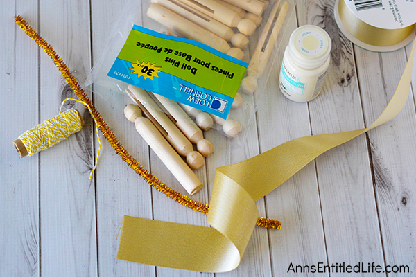 Angel Clothespin Ornament DIY. These simple to make angel ornaments are a whimsical, rustic craft nearly anyone can make. This fast craft can be customized to match your holiday decor. If you are looking for an easy to make ornament craft, this Angel Clothespin Ornament DIY is it!