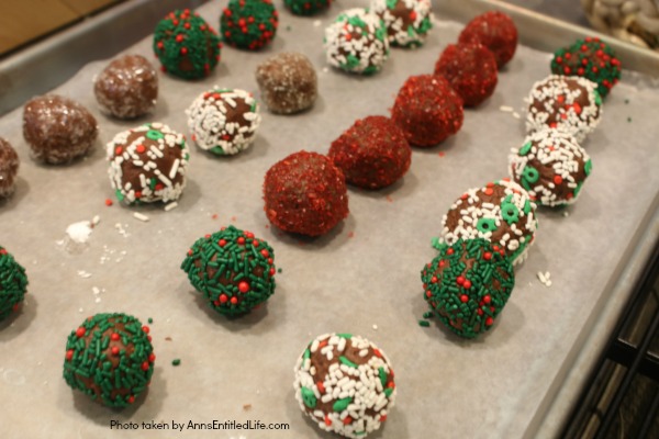 Chocolate Raspberry Truffle Bites Recipe. These simple to make chocolate truffles come with a fun raspberry surprise inside! A fun addition to your holiday cookie platter, this Chocolate Raspberry Truffle Bites Recipe is truly tasty.