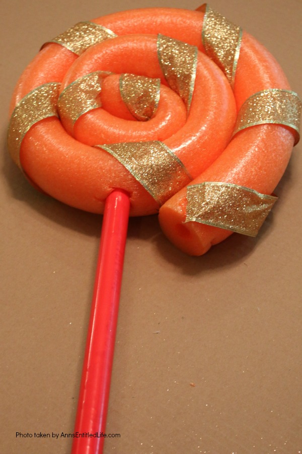 Pool Noodle Candy DIY Tutorial. This is a fast and easy to make 15 minute craft, perfect for indoor or outdoor holiday decorating. These low-cost pool noodle candy can be made in any color, so fully customizable to match your decorating color scheme!