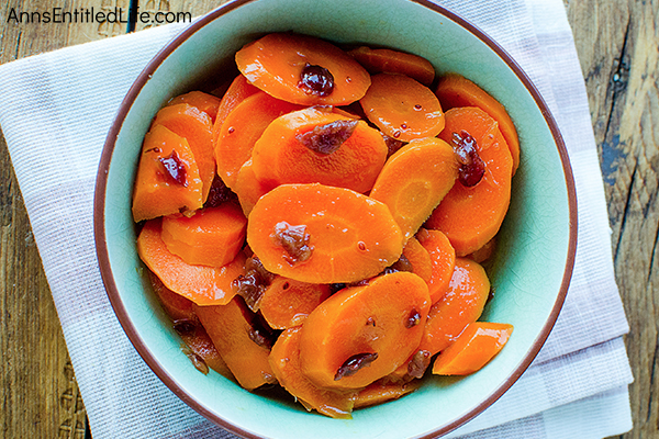 Orange and Cranberry Steamed Carrots Recipe. This simple to make side dish recipe dresses up fresh carrots to perfection. Whether you make it for the holidays, or for a family dinner, this Orange and Cranberry Steamed Carrots Recipe pairs well with turkey, pork, chicken, and beef – a wonderful accompaniment to your dinner entrée! 