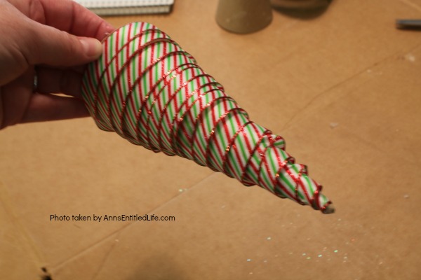 Easy Lighted Ribbon Christmas Tree. This 15 minute craft is simple to make, and highly customizable. This Easy Lighted Ribbon Christmas Tree will dress up your Christmas table, light up your mantel, or just smile as you walk by them. Only you will know how quick and easy these little trees are to put together.