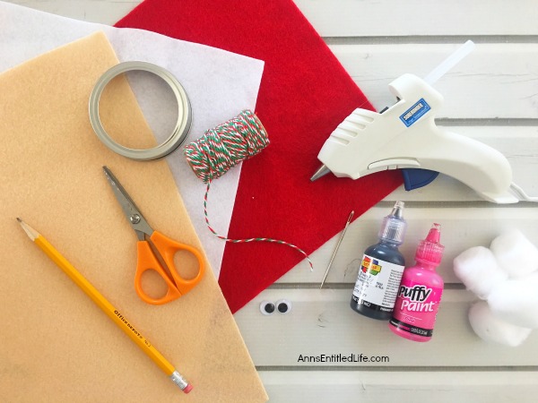 Santa Claus Mason Jar Lid Ornament DIY. Give your Christmas tree a personal touch and make your own ornaments this holiday season. Follow these step-by-step tutorial instructions to make this adorable Santa Claus Mason Jar Lid Ornament!