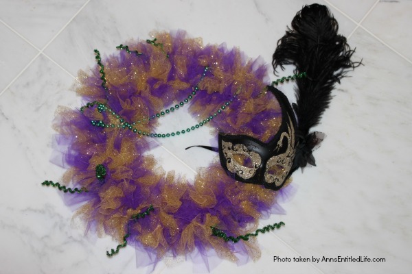 Glitter Mardi Gras Mask Wreath Tutorial. Follow the step by step instructions of this Glitter Mardi Gras Mask Wreath Tutorial to make this beautiful, sparkly, Mardi Gras Wreath. This highly customizable, simple to make, Glitter Mardi Gras Mask Wreath will look great on your front door, over your mantel, or on a wall. Truly unique Mardi Gras decor!