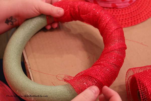 Dollar Store Craft: Heart Wreath. This simple to make heart wreath is made using dollar store finds. It comes together in under 15 minutes, and it a wonderful, inexpensive heart décor. Perfect for Valentine’s Day, Sweetest Day, or any occasion where heart décor is wanted.