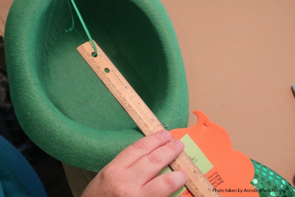 St. Patrick's Day Door Hanger DIY. Make your own St. Patty's Day door décor! This leprechaun inspired, easy DIY tutorial comes together quickly when you follow these step by step craft instructions. This St. Patrick’s Day Door Hanger DIY project is simply adorable!