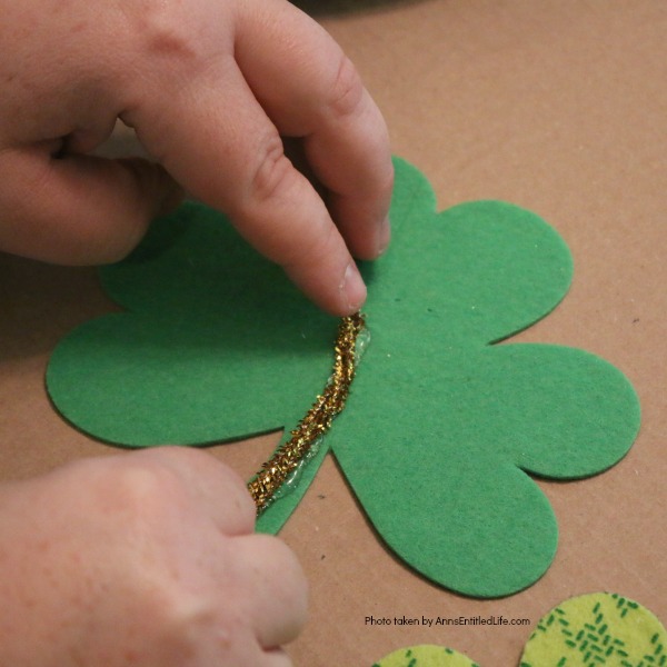 St. Patrick's Day Door Hanger DIY. Make your own St. Patty's Day door décor! This leprechaun inspired, easy DIY tutorial comes together quickly when you follow these step by step craft instructions. This St. Patrick’s Day Door Hanger DIY project is simply adorable!