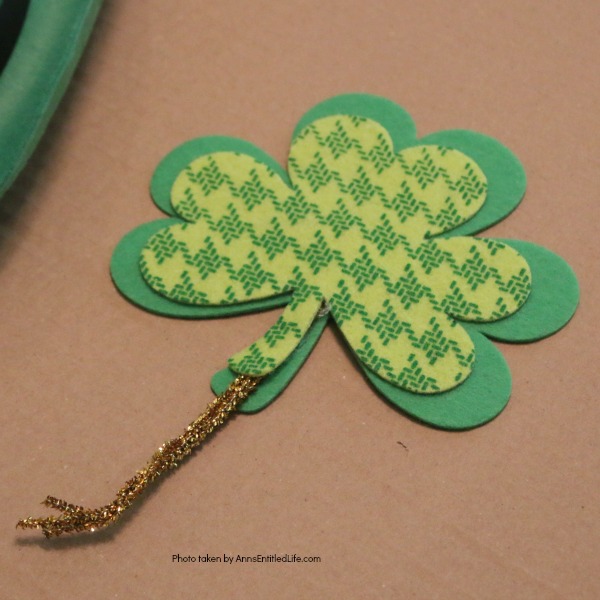 St. Patrick's Day Door Hanger DIY. Make your own St. Patty's Day door décor! This leprechaun inspired, easy DIY tutorial comes together quickly when you follow these step by step craft instructions. This St. Patrick’s Day Door Hanger DIY project is simply adorable!