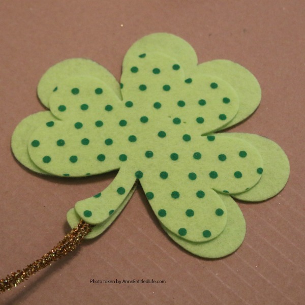 St. Patrick's Day Door Hanger DIY. Make your own St. Patty's Day door décor! This leprechaun inspired, easy DIY tutorial comes together quickly when you follow these step by step craft instructions. This St. Patrick’s Day Door Hanger DIY project is simply adorable!