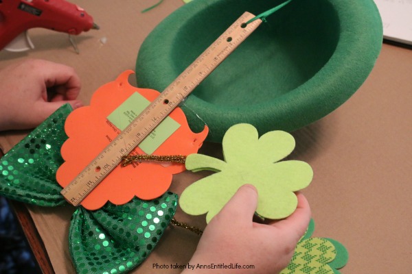 St. Patrick's Day Door Hanger DIY. Make your own St. Patty's Day door décor! This leprechaun inspired, easy DIY tutorial comes together quickly when you follow these step by step craft instructions. This St. Patrick’s Day Door Hanger DIY project is simply adorable!