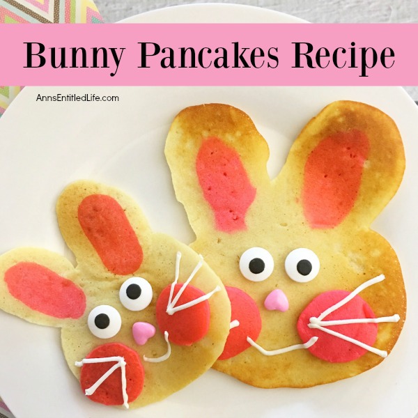 pancakes made in the shape of a rabbit head, decorated as bunnies on a white plate