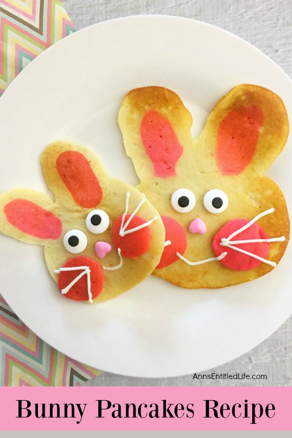 pancakes made in the shape of a rabbit head, decorated as bunnies on a white plate