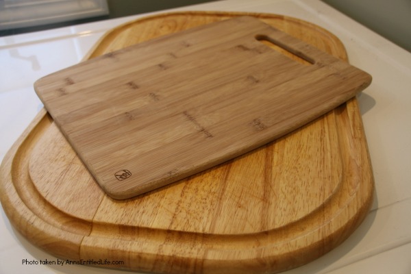 two wooden cutting boards on white surface