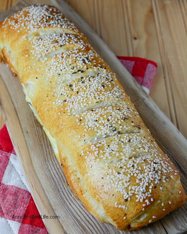 Ham and Cheese Stromboli Recipe. This delicious, easy to make, ham and cheese Stromboli is a great lunch, dinner, or party food. This can be cut into sandwich size portions for a few people, or cut into inch slices as a party food to help feed a crowd.