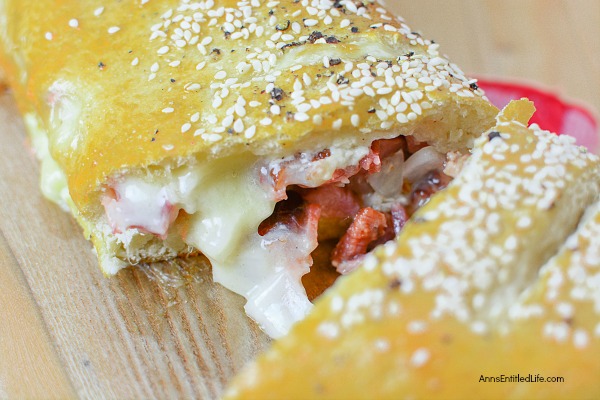 Ham and Cheese Stromboli Recipe. This delicious, easy to make, ham and cheese Stromboli is a great lunch, dinner, or party food. This can be cut into sandwich size portions for a few people, or cut into inch slices as a party food to help feed a crowd.