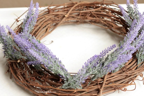 Simple Lavender Grapevine Wreath DIY. Encourage peace and relaxation in your home by making and using this scented lavender wreath. Easy to make, this simple lavender grapevine wreath comes together in about 15 minutes.