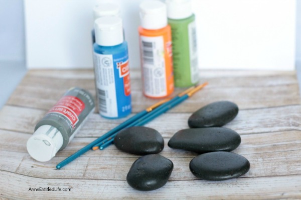 Compliment Painted Rocks. How to paint rocks. This easy painted rocks tutorial has many rock painting ideas for a beginner. Whether giving as a gift, painting rocks for the garden, or just painting a fun, decorative rock for the family room shelf, these compliment painted rocks are adorable and simple to make.
