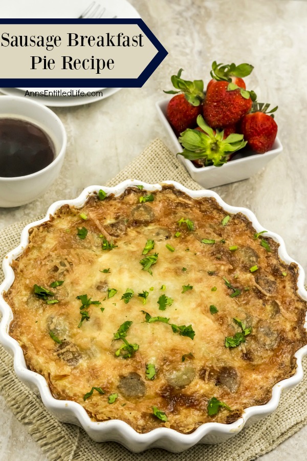 White fluted plate containing a sausage breakfast pie set atop tan placemats