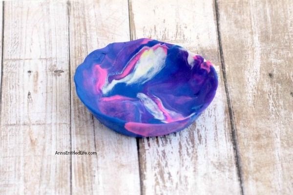 DIY Galaxy Polymer Clay Jewelry Bowl. It is so lovely to see the swirling galaxy colors of pink, purple, and blue. This galaxy clay jewelry bowl turned out amazing, and I look forward to using it every day! Follow these instructions to make your own Galaxy Polymer Clay Jewelry Bowl!