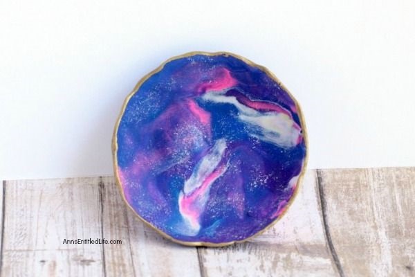DIY Galaxy Polymer Clay Jewelry Bowl. It is so lovely to see the swirling galaxy colors of pink, purple, and blue. This galaxy clay jewelry bowl turned out amazing, and I look forward to using it every day! Follow these instructions to make your own Galaxy Polymer Clay Jewelry Bowl!