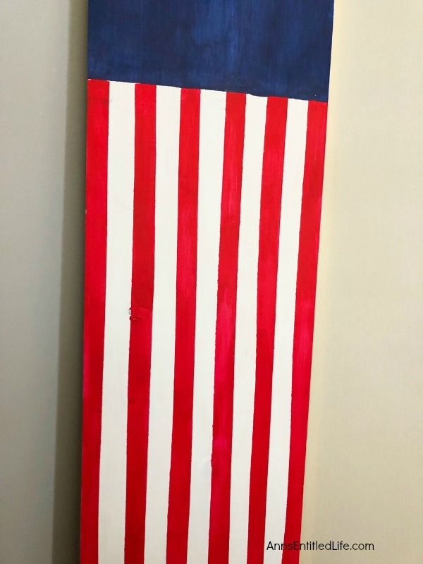 Wooden American Flag DIY Craft. This rustic American flag craft project is simple to make. Large enough for outdoor use, this rustic American flag craft can also be used inside the house. These easy step by step instructions in this short tutorial will show you how to make this wooden American flag craft is no time flat!