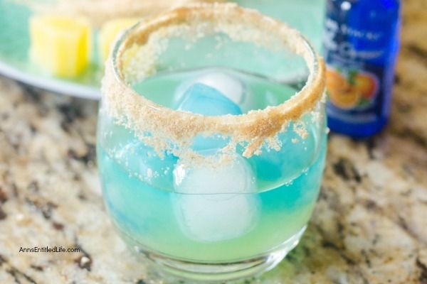 Blue Mermaid Cocktail Recipe. A tropical delight, this mermaid themed cocktail recipe might also be referred to as mermaid water! If you are looking for a tasty and delightful summertime fun cocktail recipe, give this fabulous blue mermaid cocktail a try. Yum!