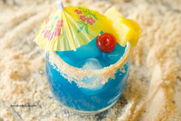 Blue Mermaid Cocktail Recipe. A tropical delight, this mermaid themed cocktail recipe might also be referred to as mermaid water! If you are looking for a tasty and delightful summertime fun cocktail recipe, give this fabulous blue mermaid cocktail a try. Yum!