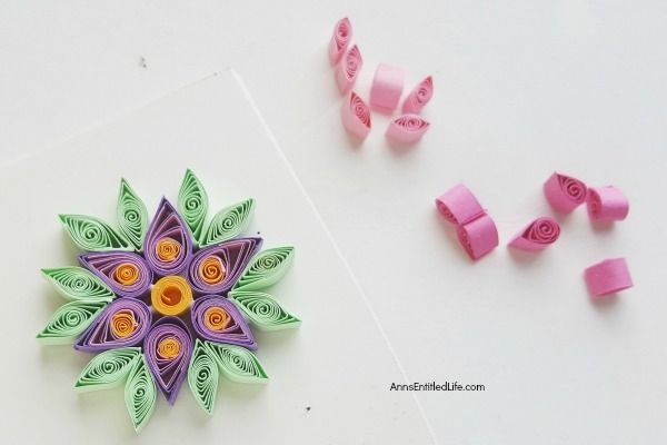 How to Make a Flower Quilling Pendant Necklace. Use these easy step by step instructions to make a beautiful flower pendant with quilling paper strips. This lovely pendant can be customized to any color to personalize your flower quilling pendant necklace to your exact taste. If you are interested in making quilling jewelry, start here!