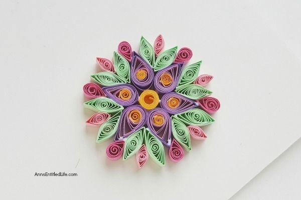 How to Make a Flower Quilling Pendant Necklace. Use these easy step by step instructions to make a beautiful flower pendant with quilling paper strips. This lovely pendant can be customized to any color to personalize your flower quilling pendant necklace to your exact taste. If you are interested in making quilling jewelry, start here!