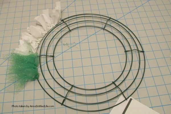 Easy Unicorn Wreath DIY. This simple to make sparkly unicorn rag wreath is an adorable and whimsical take on a unicorn wreath. Follow the step-by-step instructions of this detailed tutorial to make this fun homemade wreath. From the multicolored mane, sparkly white coat, and fanciful ears and cone, this delightful unicorn wreath is a playful take on the great mythical creature.
