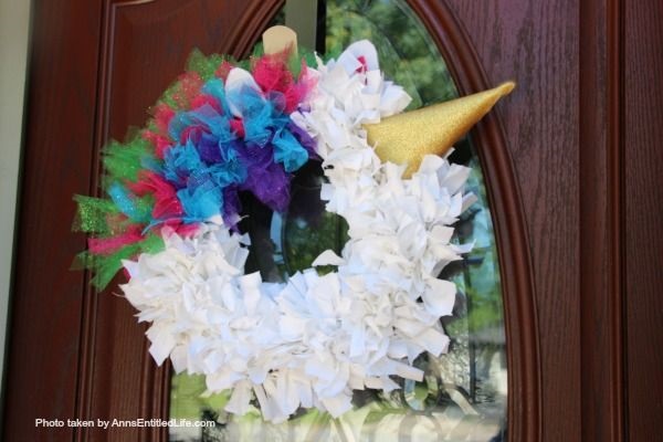 Easy Unicorn Wreath DIY. This simple to make sparkly unicorn rag wreath is an adorable and whimsical take on a unicorn wreath. Follow the step-by-step instructions of this detailed tutorial to make this fun homemade wreath. From the multicolored mane, sparkly white coat, and fanciful ears and cone, this delightful unicorn wreath is a playful take on the great mythical creature.