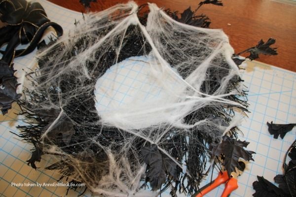 DIY Spooky Spider Halloween Wreath. This simple to make homemade Halloween wreath is spook-tacular - and takes only 15 minutes to put together. If you are looking for easy do it yourself Halloween decor, look no further than this DIY Spooky Spider Halloween Wreath, and make one today!