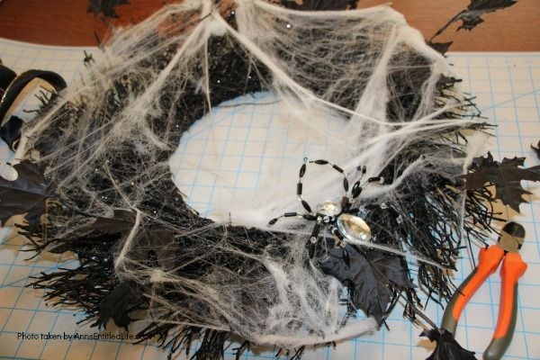 DIY Spooky Spider Halloween Wreath. This simple to make homemade Halloween wreath is spook-tacular - and takes only 15 minutes to put together. If you are looking for easy do it yourself Halloween decor, look no further than this DIY Spooky Spider Halloween Wreath, and make one today!