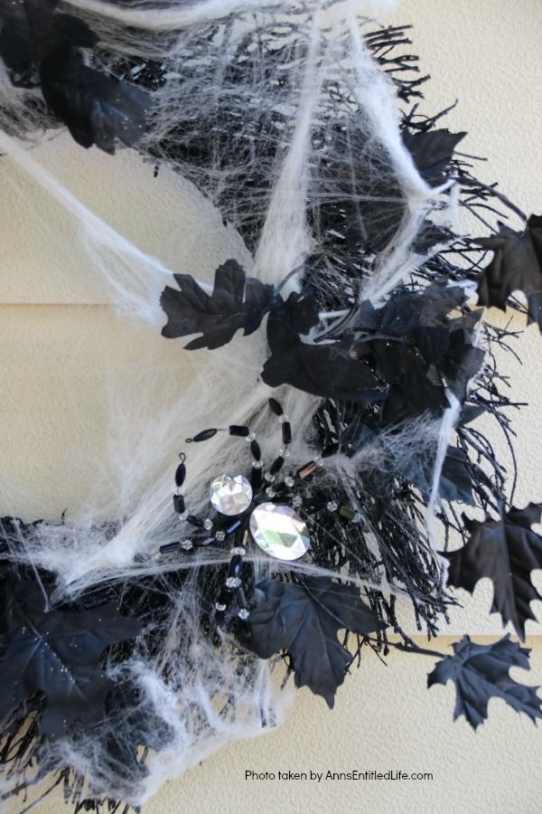 DIY Spooky Spider Halloween Wreath. This simple to make homemade Halloween wreath is spook-tacular - and takes only 15 minutes to put together. If you are looking for easy do it yourself Halloween decor, look no further than this DIY Spooky Spider Halloween Wreath, and make one today!