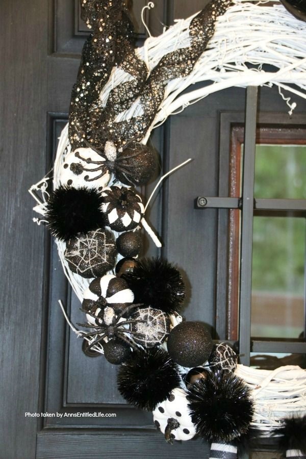 Black and White Witch Wreath DIY. Make your own witch wreath for Halloween this year using these easy step-by-step tutorial instructions. This monochromatic black and white witch's door decor wreath is simple to make, and look oh so elegant. Seriously. Elegant Halloween decor! Who would have thought! Get the straightforward instructions below!