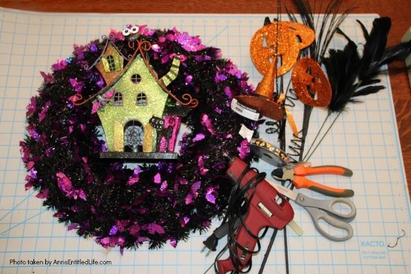 Haunted House Halloween Wreath. This whimsical haunted house Halloween wreath is an easy to put together - truly a 15-minute craft!  If you are looking for simple Halloween wreath ideas, look no further than this fun haunted house Halloween wreath DIY.