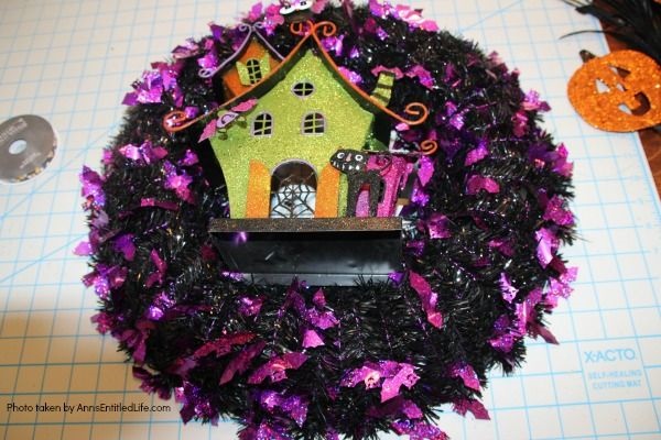 Haunted House Halloween Wreath. This whimsical haunted house Halloween wreath is an easy to put together - truly a 15-minute craft!  If you are looking for simple Halloween wreath ideas, look no further than this fun haunted house Halloween wreath DIY.